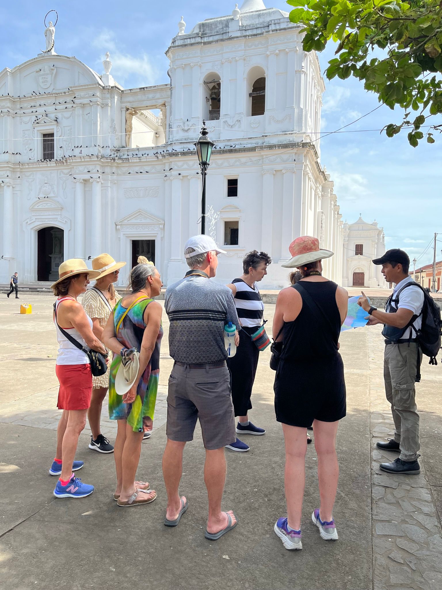 Travelers with a local guide in Leon